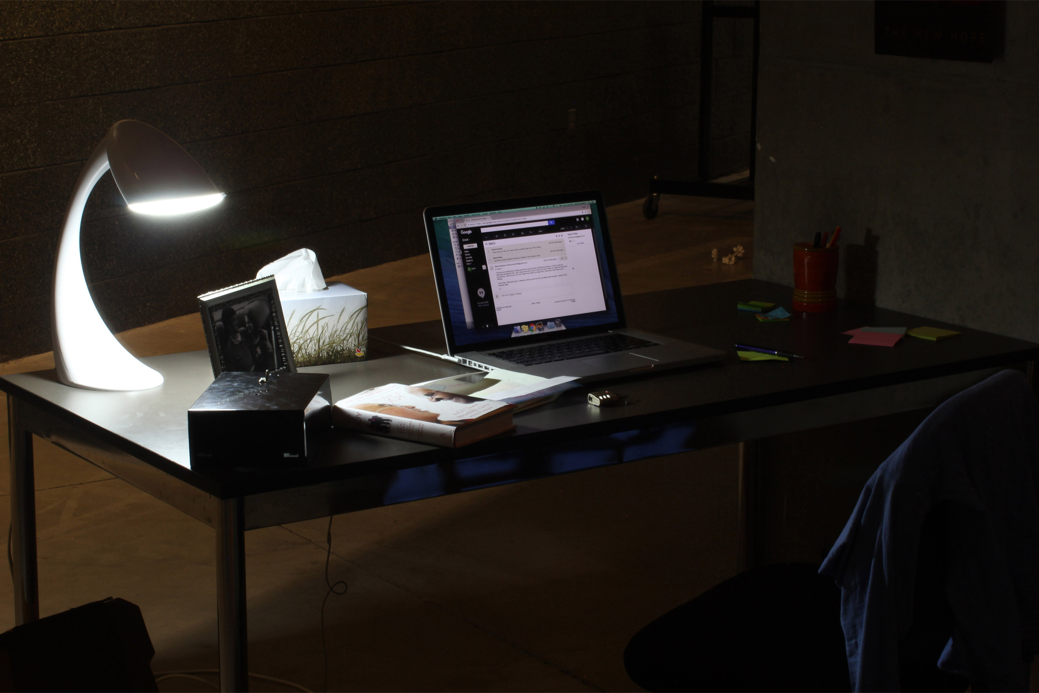 View full size version of dark desk illuminated by a lamp